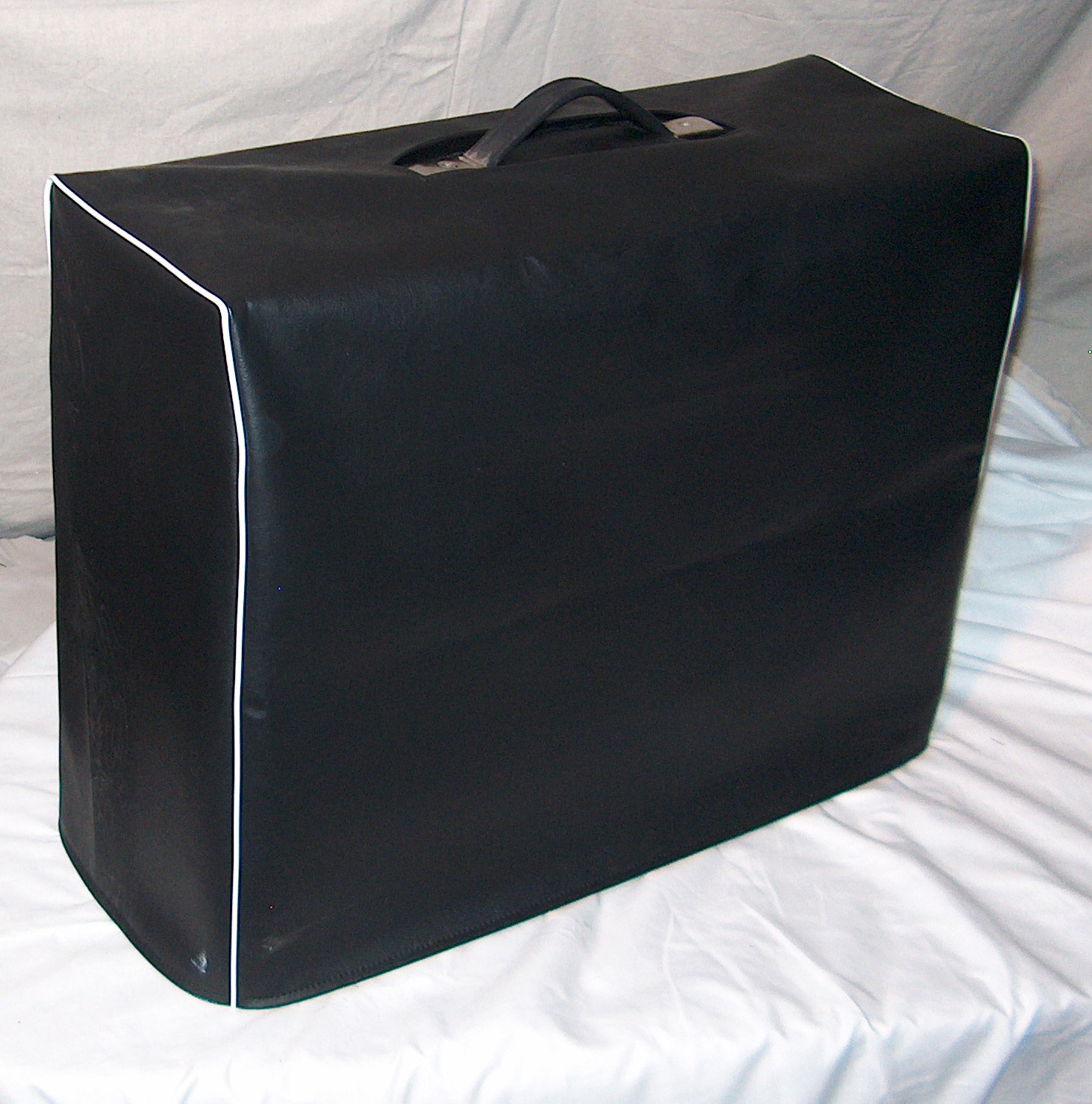 Example of black vinyl amp cover with white piping